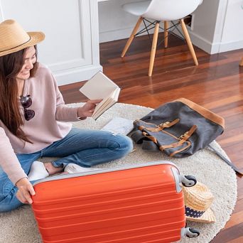 Woman finalizing the details of her suitcase