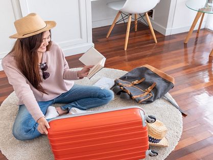Woman finalizing the details of her suitcase