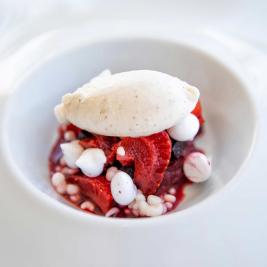 Strawberries and red berries, meringue and pink peppercorn